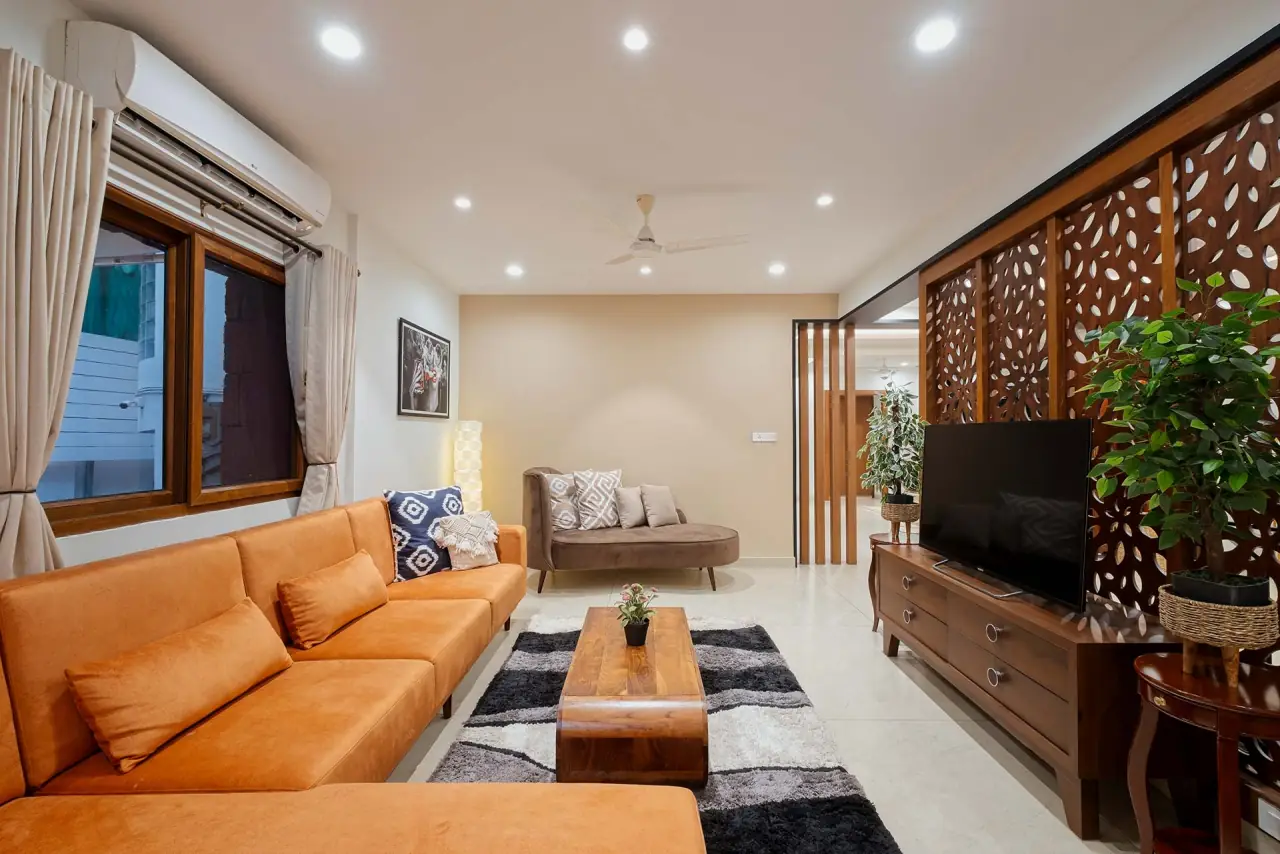 Living room with leather sofa and carved screen